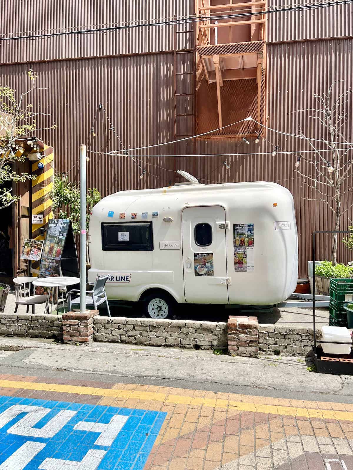 A vintage truck in front of a cafe in Jeonpo Cafe Street, Busan, South Korea.