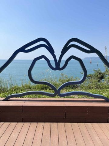 A sculpture of 2 hands forming a heart in Busan.