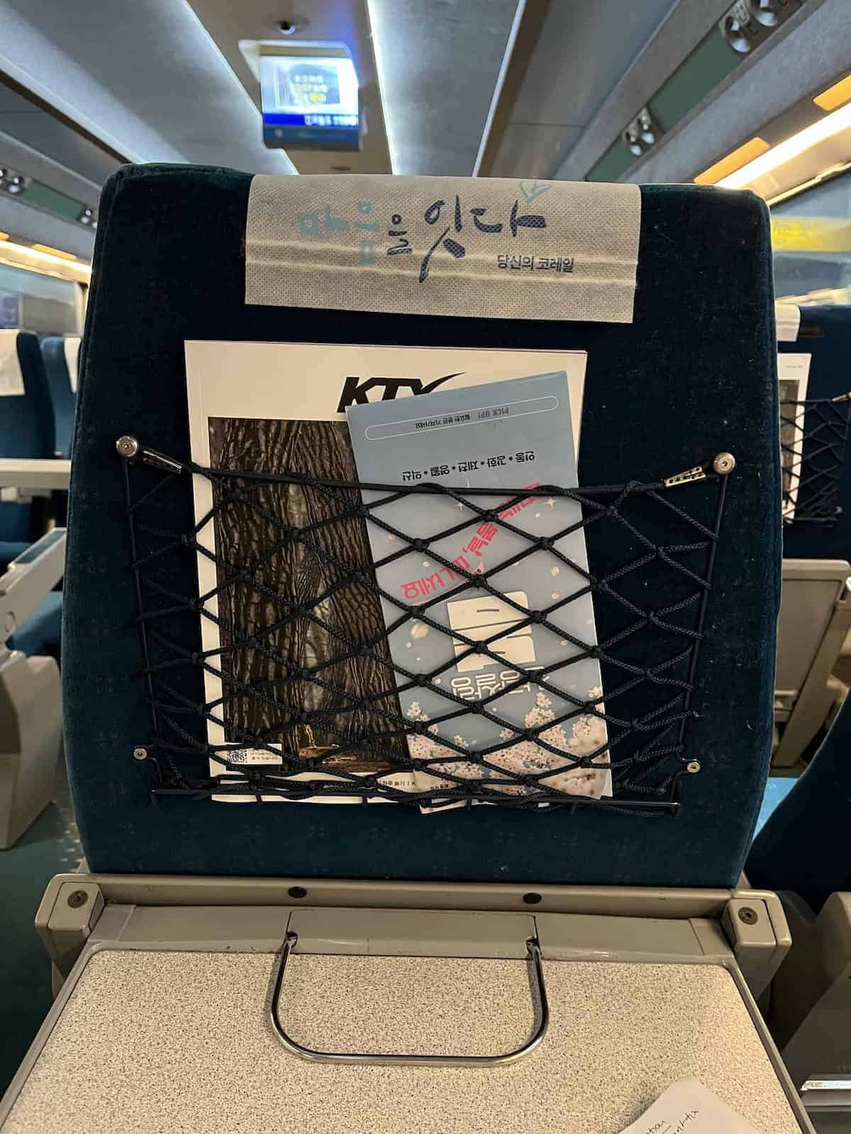 There are some reading materials in front of the seat.