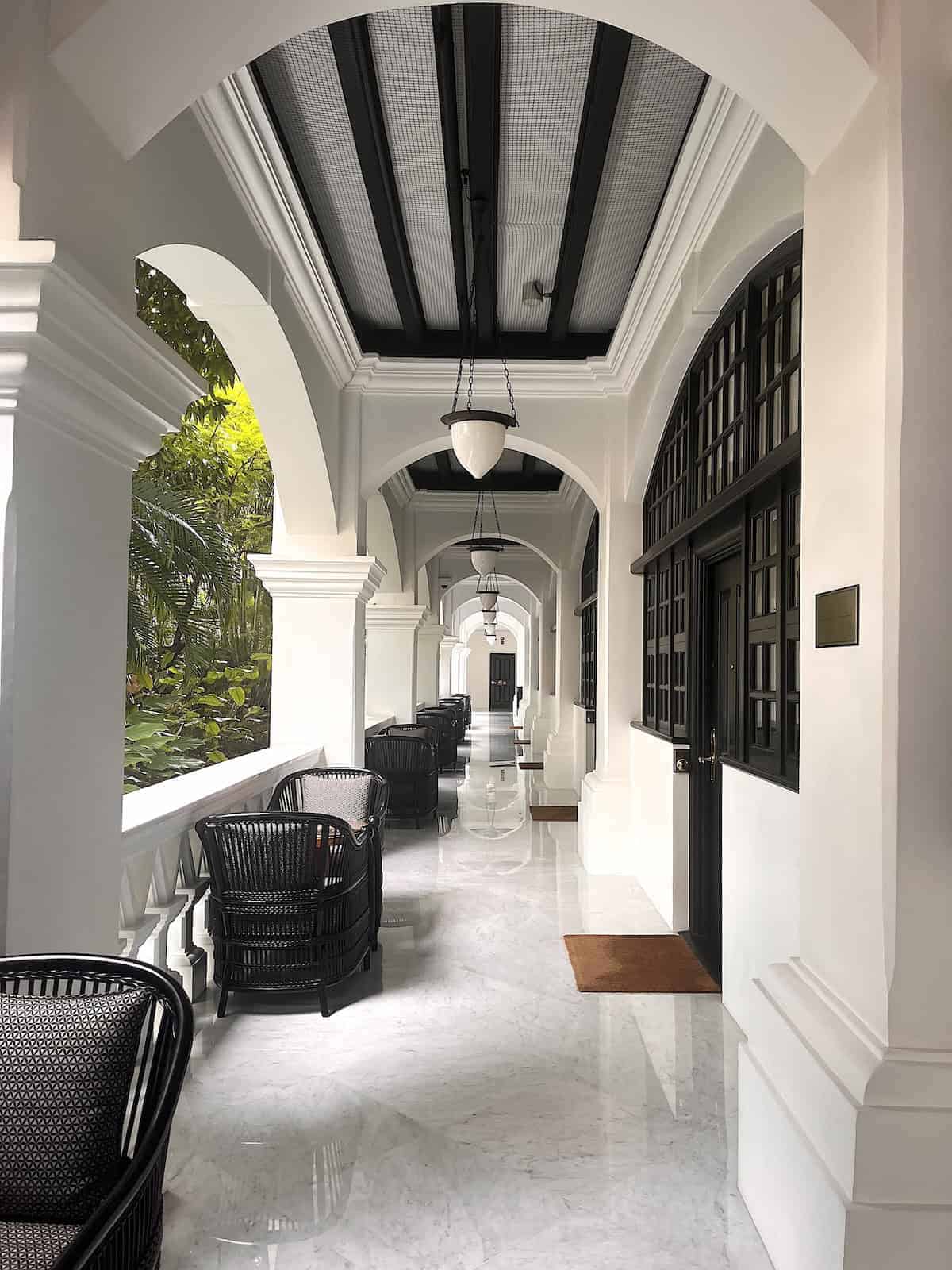 The walkway outside a guest room at Raffles Hotel Singapore.